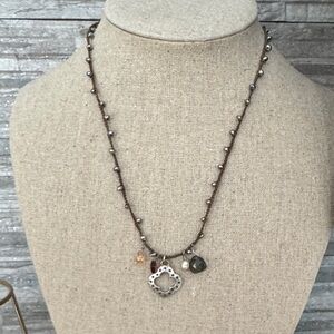 Stella & Dot Chic Brown fabric Beaded Necklace with Silver Charms.